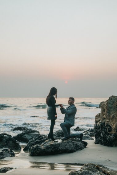 A marriage proposal shoot is a wonderful way to commemorate popping the big question. Learn how to get the perfect snaps like this man proposing on one knee to his girlfriend on a beach.