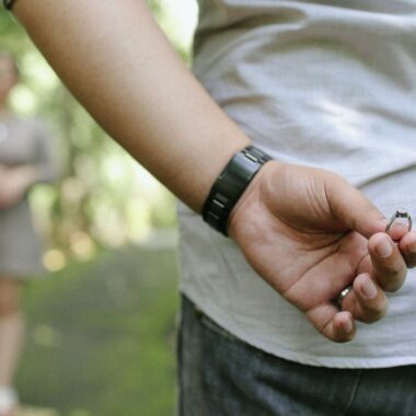 Man hiding engagement ring